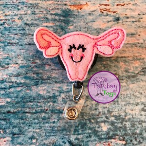 Uterus pin or badge reel ID holder