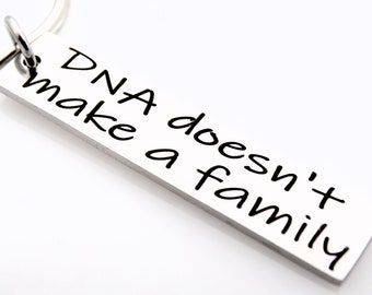 DNA Doesn't make a family, laser engraved keychain