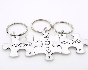 Set of 3 Interlocking Puzzle Piece Keychains, Customized with your locations and an initial of choice