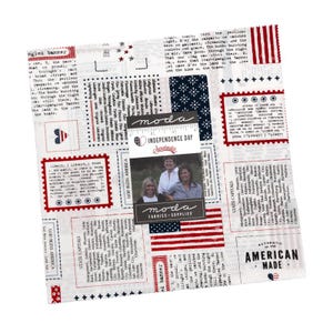 May include: A square fabric panel with a patriotic theme. It features a white background with red and blue accents, including text, stars, and a small American flag design. The fabric includes the text "American Made".