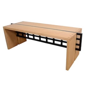 May include: A light wood bench with a black metal grid design. The bench has a simple, modern design.