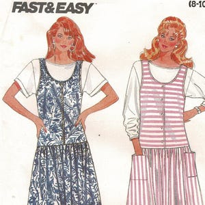 May include: A vintage sewing pattern featuring two dress designs. One dress has a blue and white floral print, and the other has red and white stripes. The pattern is labeled "FAST & EASY" and includes size information.