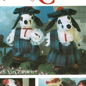 May include: A sewing pattern for four different dalmatian dog plush toys. The pattern includes a Scottish kilt, a dress, overalls, and a straw hat. The pattern is by Faith Van Zanten.
