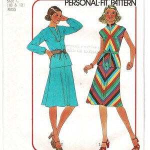May include: A Simplicity 7966 sewing pattern envelope for a two-piece outfit. The illustration shows two variations: a solid turquoise long-sleeve top and skirt with a brown belt, and a sleeveless top and skirt with a multi-colored chevron pattern.