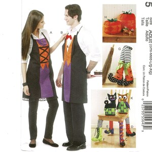 May include: A sewing pattern featuring Halloween-themed aprons and decorative items. The aprons are black with purple and orange accents. Other items include pumpkin-shaped decorations, witch legs, and chair covers with cat and owl designs.