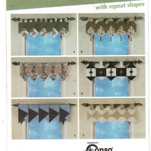 May include: Simplicity Home Decorating 4973 sewing pattern envelope for Easy Window Toppers with repeat shapes. The front displays six variations of decorative window valances labeled A through F, featuring different fabric patterns, colors, and geometric shapes hanging from curtain rods.