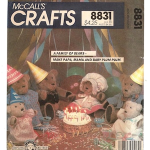 May include: McCall's Crafts pattern 8831 featuring a family of teddy bears. The bears are dressed for a party, with a cake and party hats. The text reads "A Family of Bears - Make Papa, Mama and Baby Plum Plum."