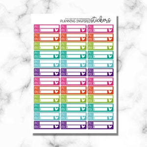 May include: A sheet of colorful stickers with the text "PILL DUE" and a heart shape. The stickers are designed for use in a planner or journal.