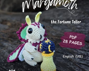 May include: A crochet amigurumi moth creature named Margamoth the Fortune Teller, featuring a cream-colored body, yellow antennae, and purple-trimmed green wings. It holds a dark blue and yellow orb. Text reads: Margamoth the Fortune Teller, PDF 28 PAGES, English (US), CODENAME_BUTTERFLY.