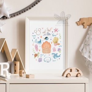 May include: A framed print with a white background featuring a variety of colorful cartoon sea creatures, including a shark, a stingray, a sea turtle, a jellyfish, a starfish, a seahorse, a clam, and a seagull. The print also includes a Mickey Mouse head and the text "Designs by Ghana".