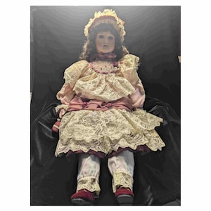 French Mundia Porcelain Doll. 22 inches.