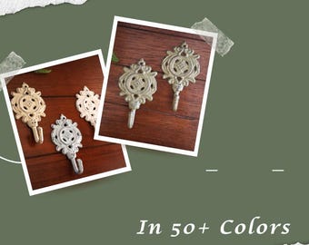 May include: Four decorative hooks in gold and silver finishes. The hooks have a detailed ornate design and are perfect for hanging keys, jewelry, or other small items.  In 50+ Colors.