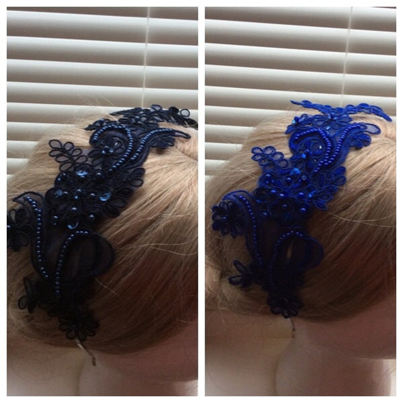 May include: Two hair accessories made of black and blue lace with beaded embellishments. The hair accessories are shown on a mannequin head with blonde hair.