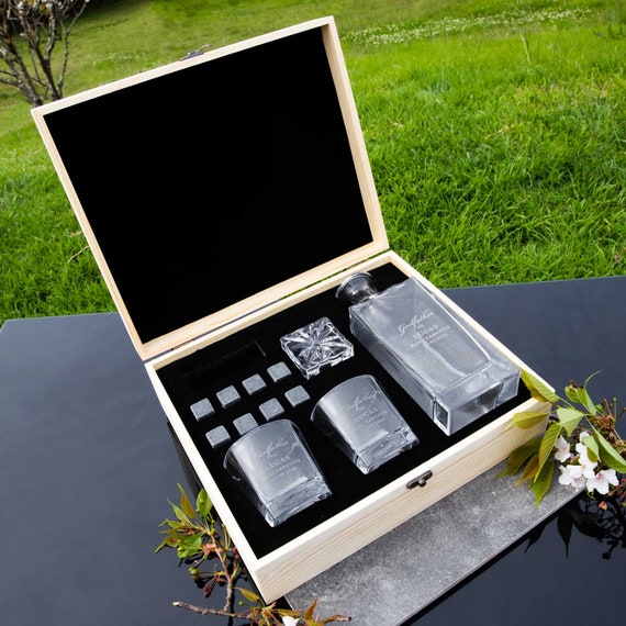 A genuinely touching keepsake — an engraved wooden box housing a whiskey decanter and glasses, built around the very specific and heartfelt 'Godfather' occasion that's hard to find done this well.