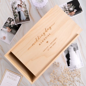May include: A wooden box with a lid, engraved with the words "wedding day memories", the couple's names "Taylah & Anthony", and the date "07-03-2026".