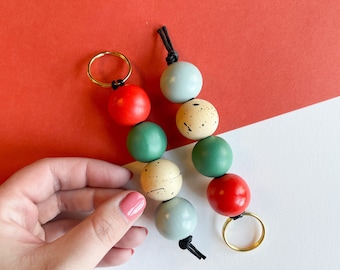 The Mona keychain | handpainted wooden bead keychain