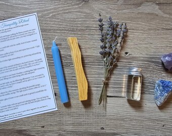 May include: A peace and tranquility ritual kit with instructions, a blue candle, a wooden stick, dried lavender, a small bottle of oil, a purple amethyst crystal, and a blue lapis lazuli crystal.