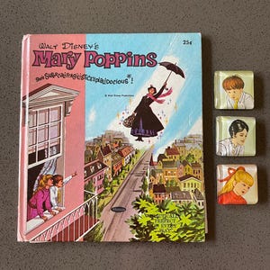 May include: Vintage "Mary Poppins" book cover with a colorful illustration of Mary Poppins flying over a town. The cover features the title and the phrase "Supercalifragilisticexpialidocious!". Also included are three square glass magnets with children's portraits.