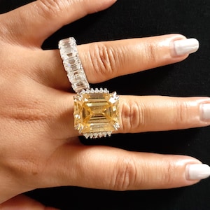 Dazzling 22.55 Carat SI1 Clarity Emerald Cut Champagne Yellow Color Lab Grown Diamond With Colorless Diamond Accents Ring Engagement Jewelry