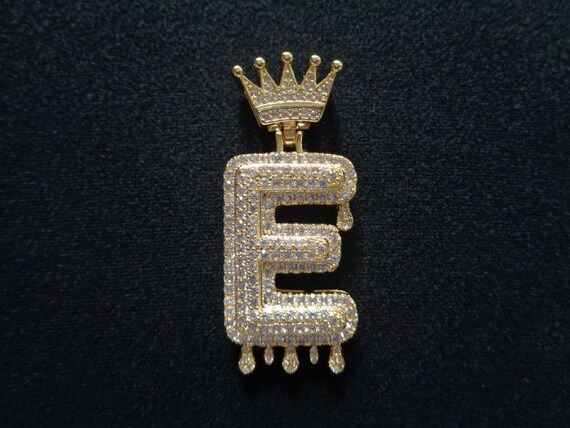 Charm pendant letter E with white stones gold plated