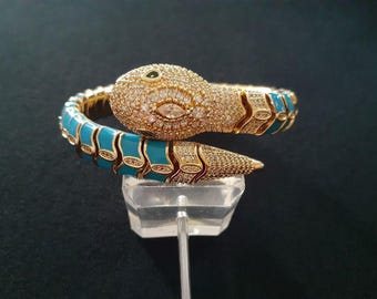 印象的な動物の蛇のコイルバングルブレスレット。18カラットのイエロー