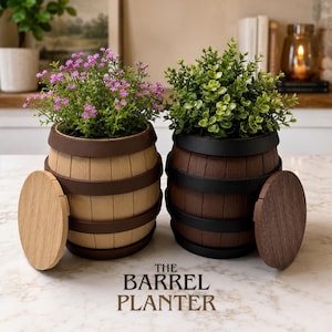 May include: Two barrel-shaped planters, one light brown and one dark brown, each with a removable lid. The light brown planter holds pink flowers, and the dark brown planter holds green foliage. The text "THE BARREL PLANTER" is at the bottom.