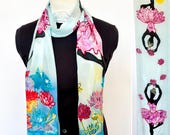 Flat crepe silk scarf with hand-painted black ballerina dancing over flowers on a pale blue background  14x72"