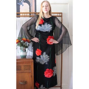 women's dark blue and black angel vintage dress women's dark blue and black angel vintage dress Vintage Chanel navy blue  logo dress  Wararni.com