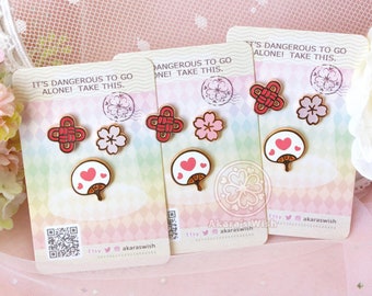 Japanese Enamel Pin Mini Filler Pins set with a pink glitter sakura blossom, white fan and red knot.