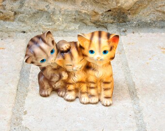 Kitsch piggy bank with kittens