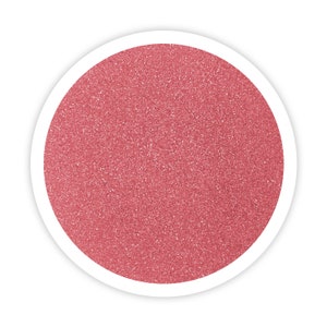 May include: A close-up of a pink glitter sand, perfect for crafts and decorations.