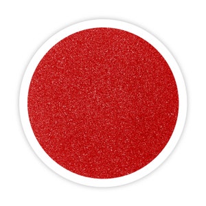 May include: A close-up of a red glitter, which is a fine, sparkly material used for crafts and decorations.