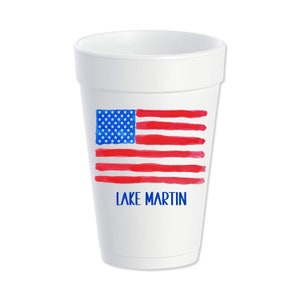 May include: White foam cup with a watercolor American flag design and the text "LAKE MARTIN" in blue.
