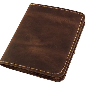 May include: A brown leather wallet with a stitched edge.