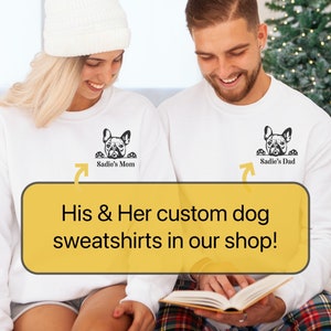 May include: Two white sweatshirts with a black silhouette of a French bulldog peeking over the top. The text "Sadie's Mom" and "Sadie's Dad" are printed on the sweatshirts.