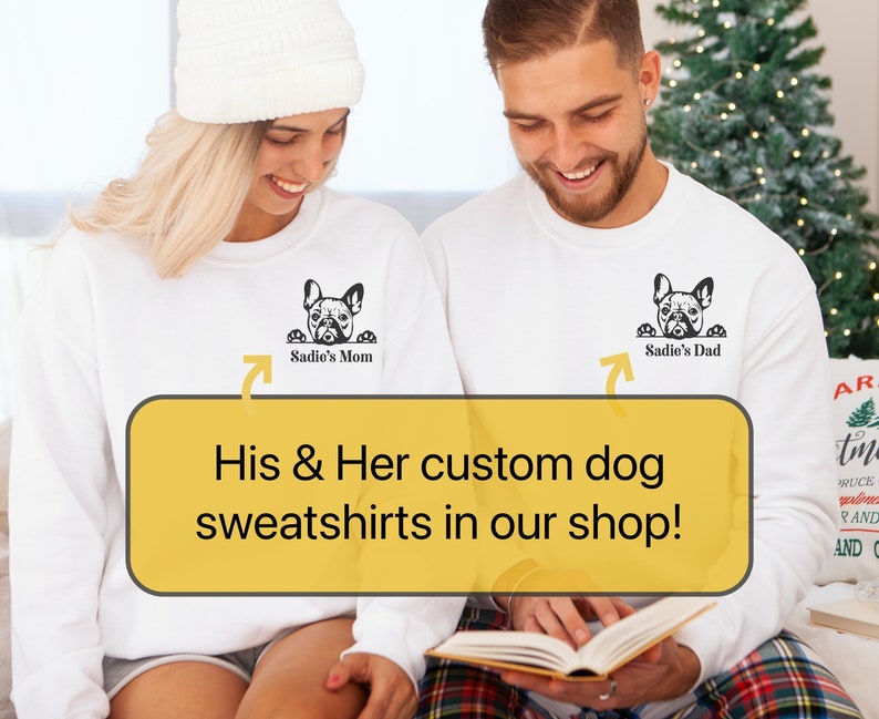 May include: Two white sweatshirts with a black silhouette of a French bulldog peeking over the top. The text "Sadie's Mom" and "Sadie's Dad" are printed on the sweatshirts.