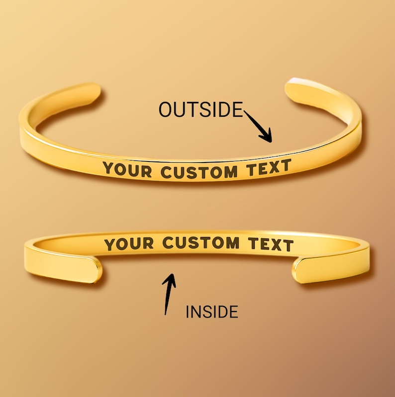May include: Two gold-colored, open cuff bracelets. The top bracelet shows the word "OUTSIDE" with an arrow pointing to the outside of the bracelet. The bottom bracelet shows the word "INSIDE" with an arrow pointing to the inside of the bracelet. Both bracelets have the text "YOUR CUSTOM TEXT".