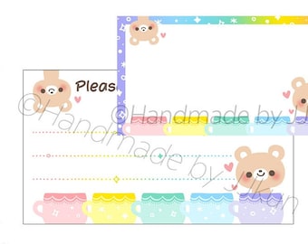 May include: Two bear-themed sticker designs. The larger sticker is 3.5 inches by 2 inches and features a bear in a teacup with a rainbow background. The smaller sticker is 1.4 inches by 2.6 inches and features a bear with a rainbow and star background.