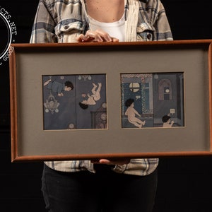 May include: A framed artwork with two panels depicting children in different scenes. The left panel shows a child hanging from a chandelier, while the right panel shows a child sitting on a rug with another child standing behind them. The artwork is in a brown wooden frame with a gray mat.
