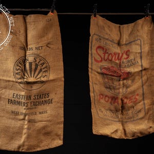 May include: Two vintage burlap sacks, each labeled "100 lbs. NET." One sack features a sunburst logo and text for "Eastern States Farmers Exchange." The other sack displays "Story's Potatoes" with a basket of potatoes.