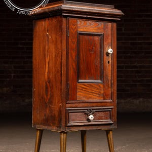 Early American Oak Cabinet with Tapered Brass-Capped Legs