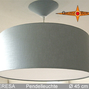 May include: A gray fabric pendant light with a white inner lining. The light is 45 inches in diameter and has a simple, modern design.