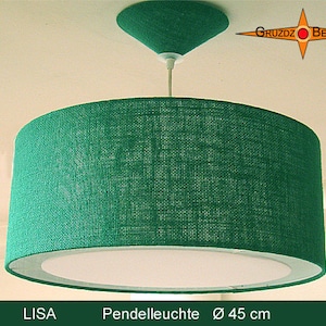 May include: A green fabric pendant light with a white inner shade. The light is 45 inches in diameter and has a woven texture. The light is labeled "LISA Pendelleuchte Ø 45 cm".