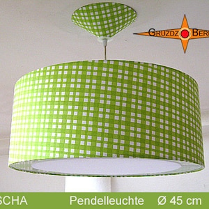 May include: A green and white gingham patterned pendant light with a white diffuser. The light is 45 inches in diameter. The text "SASCHA" and "Pendelleuchte Ø 45 cm" is visible in the image.