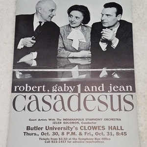 May include: Black and white photo of three people, Robert, Gaby, and Jean Casadesus, performing with the Indianapolis Symphony Orchestra, conducted by Izler Solomon. The concert will take place at Butler University's Clowes Hall on Thursday, October 30th at 8:00 PM and Friday, October 31st at 8:45 PM. Tickets are available at the Symphony Box Office for $2.50 or by calling 923-1457 for advance reservations.