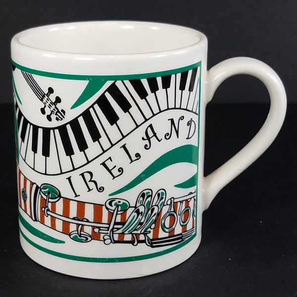 Carrigaline Pottery Ireland green white music intrument themed collectible coffee cup mug
