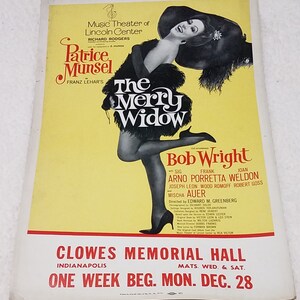 May include: A vintage poster advertising a production of "The Merry Widow" starring Patrice Munsel and Bob Wright. The poster features a black and white photo of Patrice Munsel in a glamorous pose. The poster is yellow with red and black text. The show is playing at Clowes Memorial Hall in Indianapolis for one week beginning Monday, December 28th.