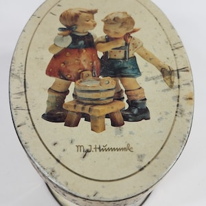 M.I. Hummel ivory cream round oval tin box with lid 1993 Aged Patina