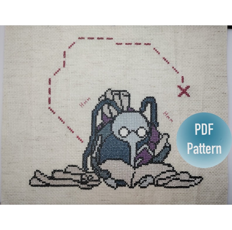 May include: Cross stitch pattern for a blue and purple creature wearing glasses and a backpack, sitting on a pile of books. The pattern includes the text "Hmm" and "PDF Pattern".