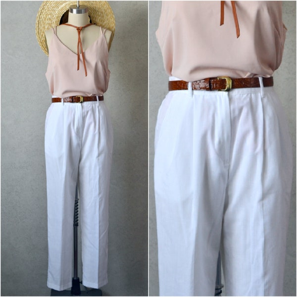 white poly rayon blend pleated tapered leg high rise slacks with pockets . 90s vintage . 26-30" waist